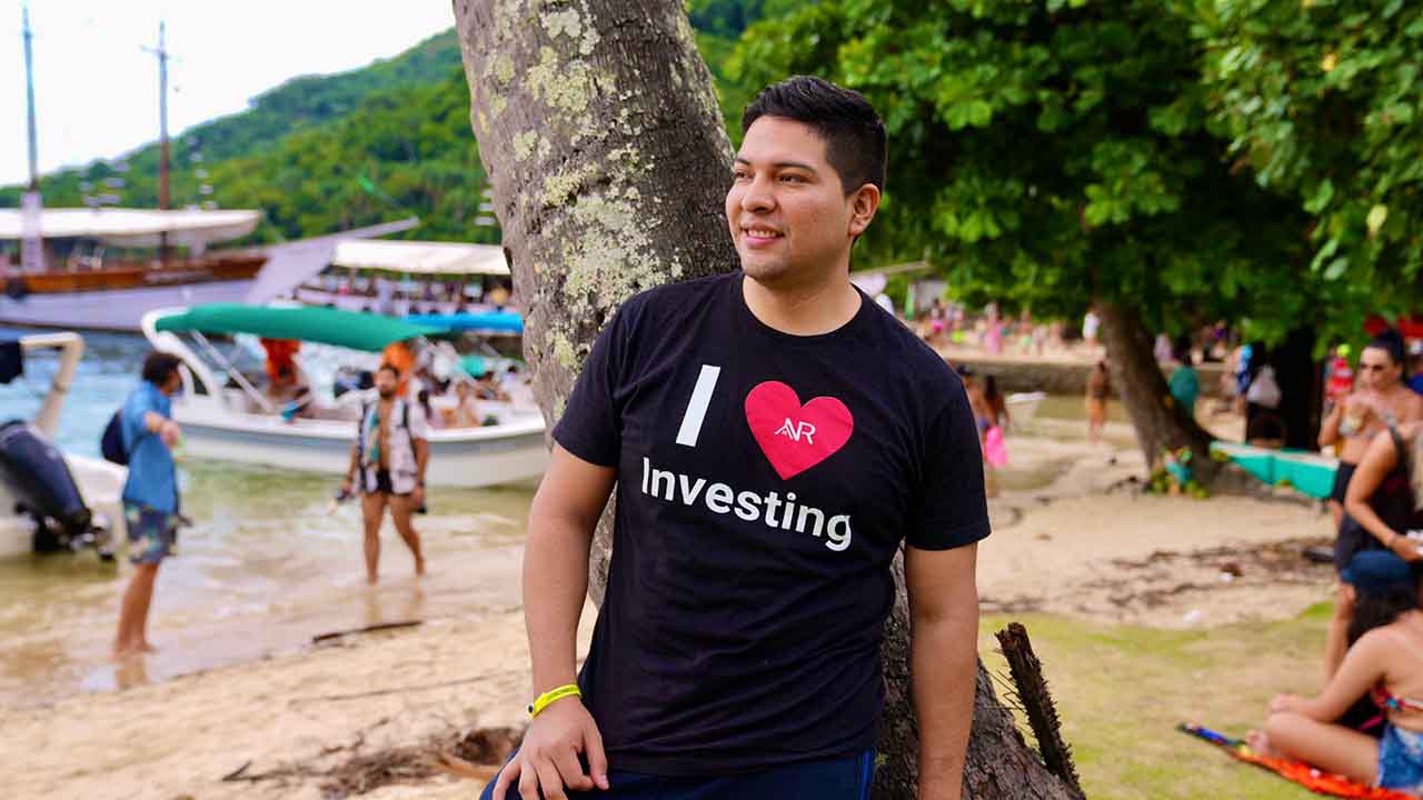 Anthony wearing I love investing T-shirt